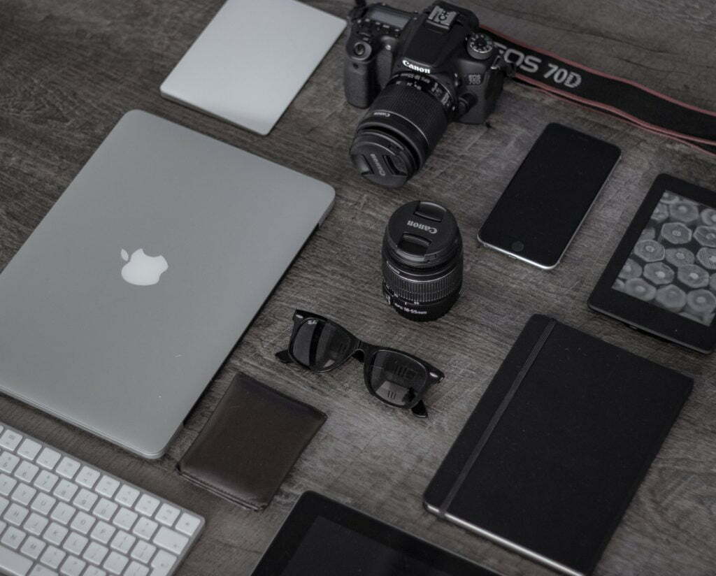 a laptop computer and other electronics on a table