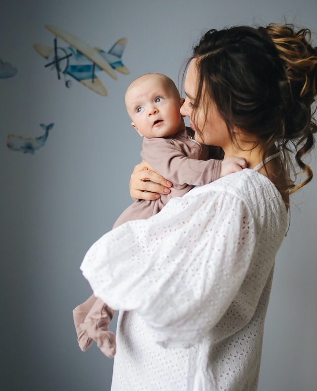 a person holding a baby