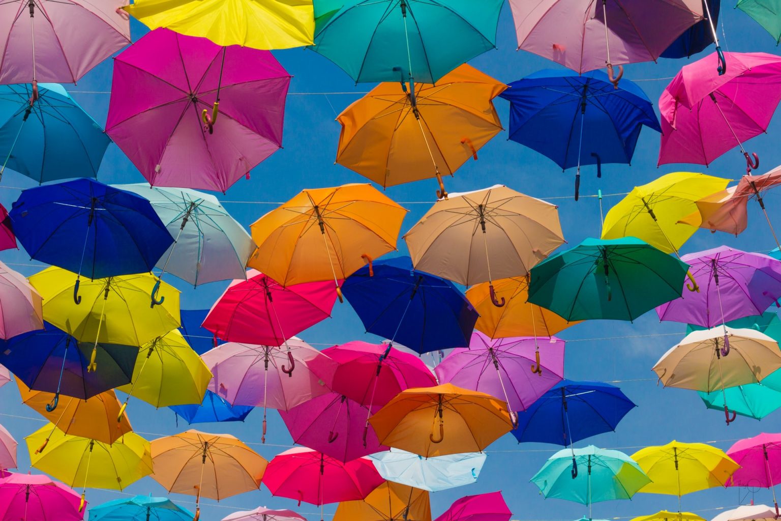 a group of umbrellas in the air