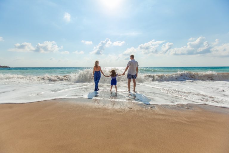 a family walking on the beach