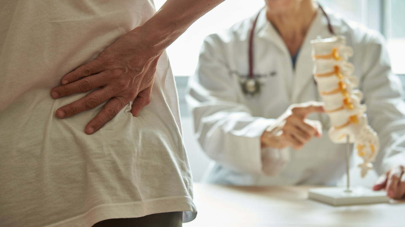 a doctor holding a patient's hand