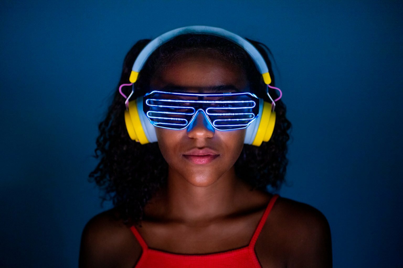 a person wearing blue and yellow headphones