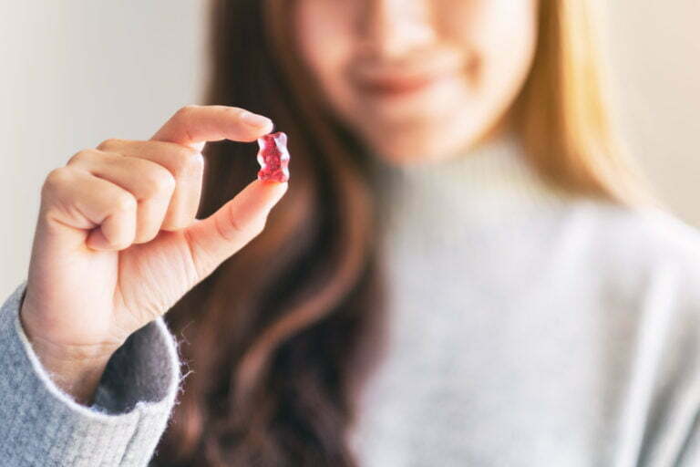 WOMAN HOLDING A GUMMIE