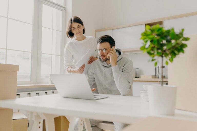 two people over a laptop