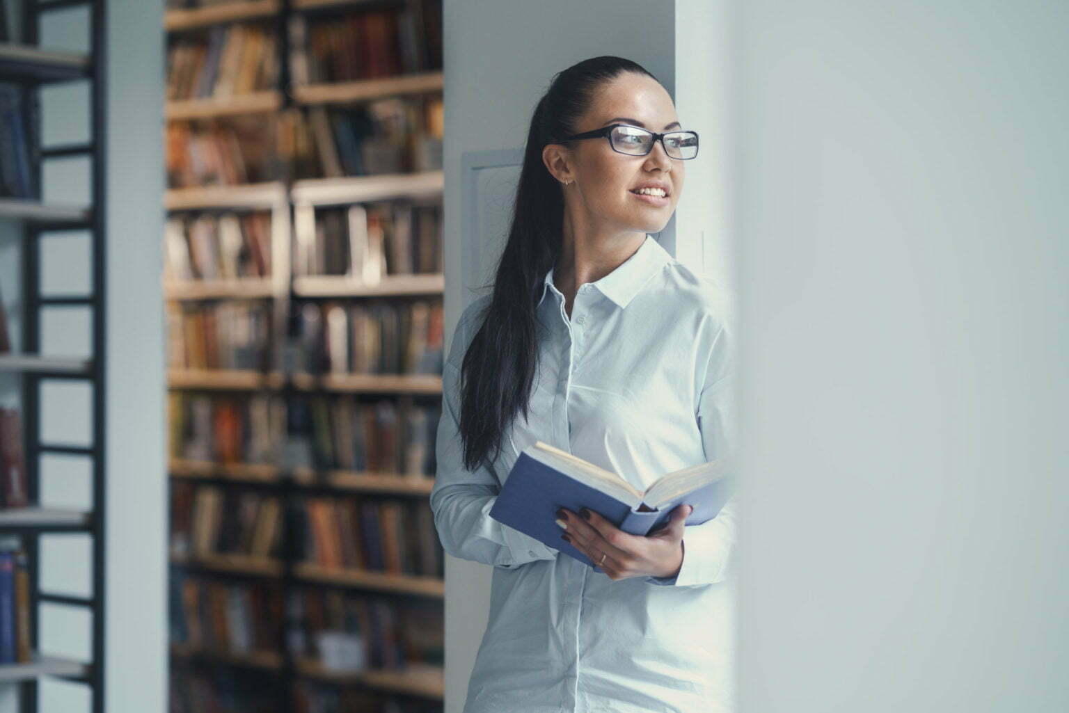 young woman standing by a door