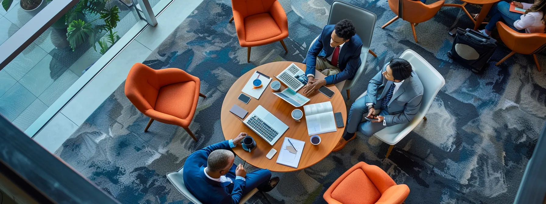 business professionals engage in a strategic discussion around an anchor relevant to systemcenter alaska.